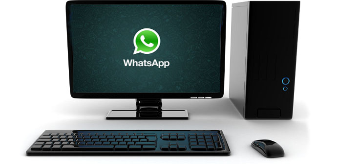 Computadora de escritorio sobre fondo blanco con el logo de Whatsapp en la pantalla